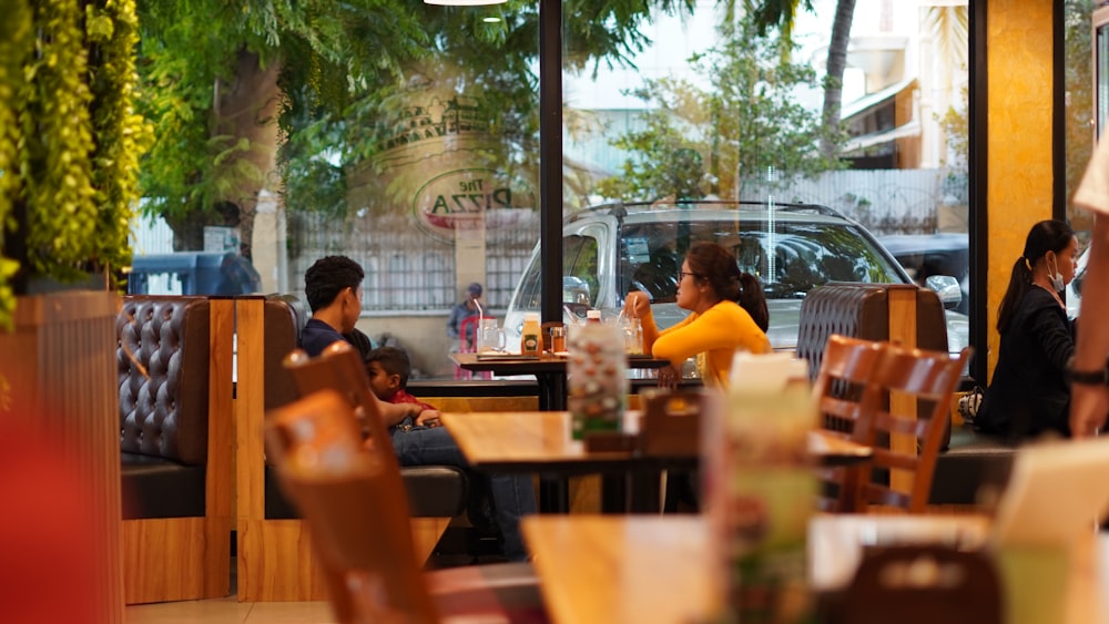 people sitting on chair in restaurant