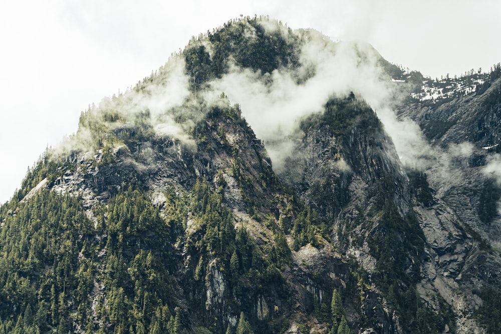 green and gray mountain under white clouds during daytime