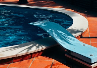 white and blue swimming pool