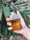 person holding calvin klein perfume bottle
