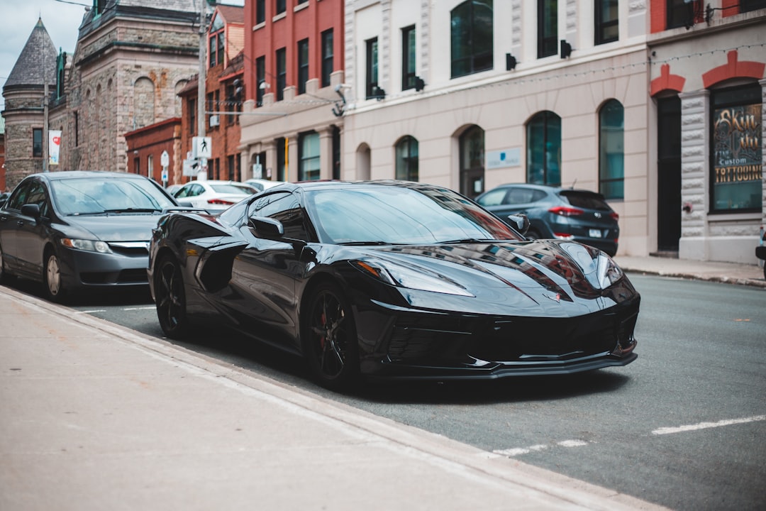 black porsche 911 parked on street during daytime