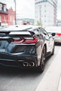 A sleek black Lamborghini parked on a city street.