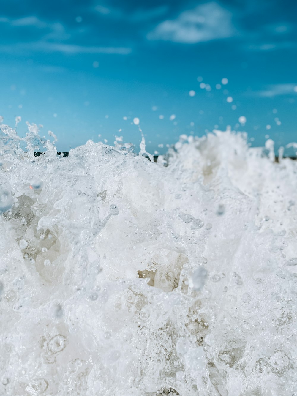 white ice on blue water