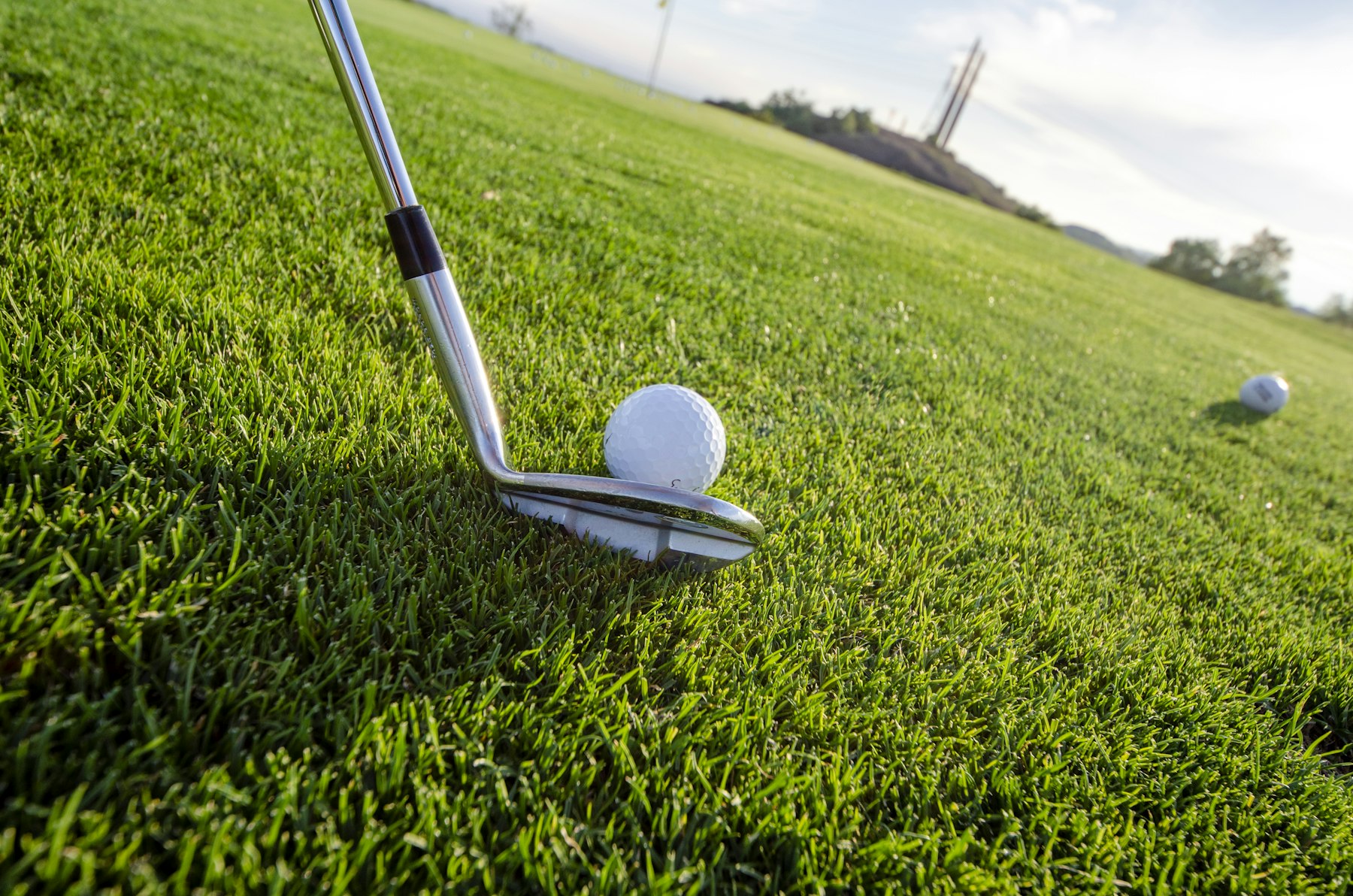 Indoor golf simulator setup with screen and turf