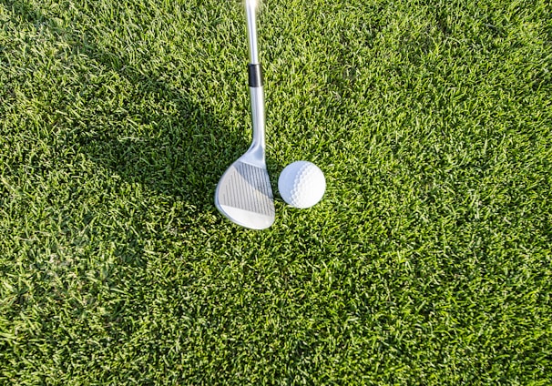 white golf club on green grass field