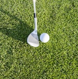 white golf club on green grass field