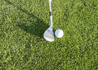 white golf club on green grass field