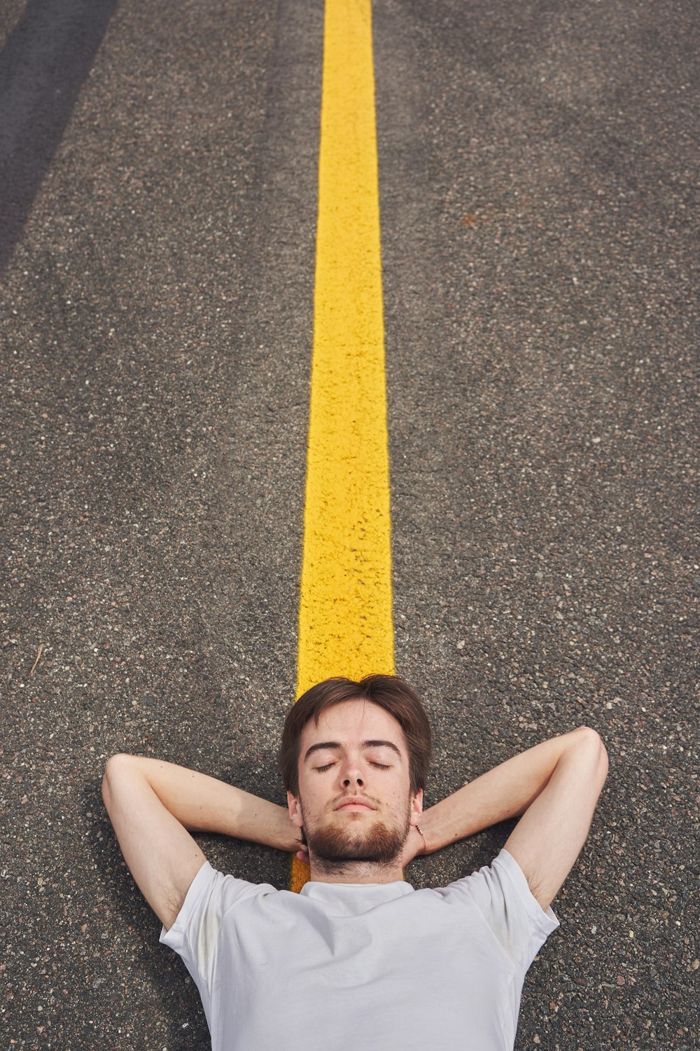 girl lying on the road