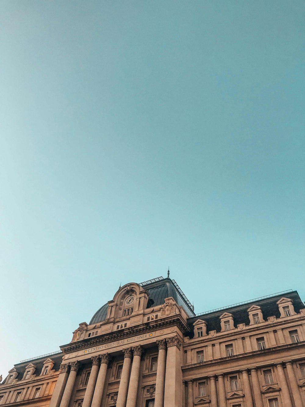 brown concrete building under blue sky during daytime