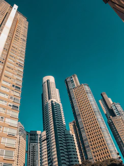 brown and white high rise buildings under blue sky during daytime