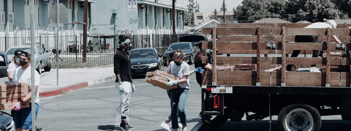 Collective Support volunteers distributing food boxes to families across America