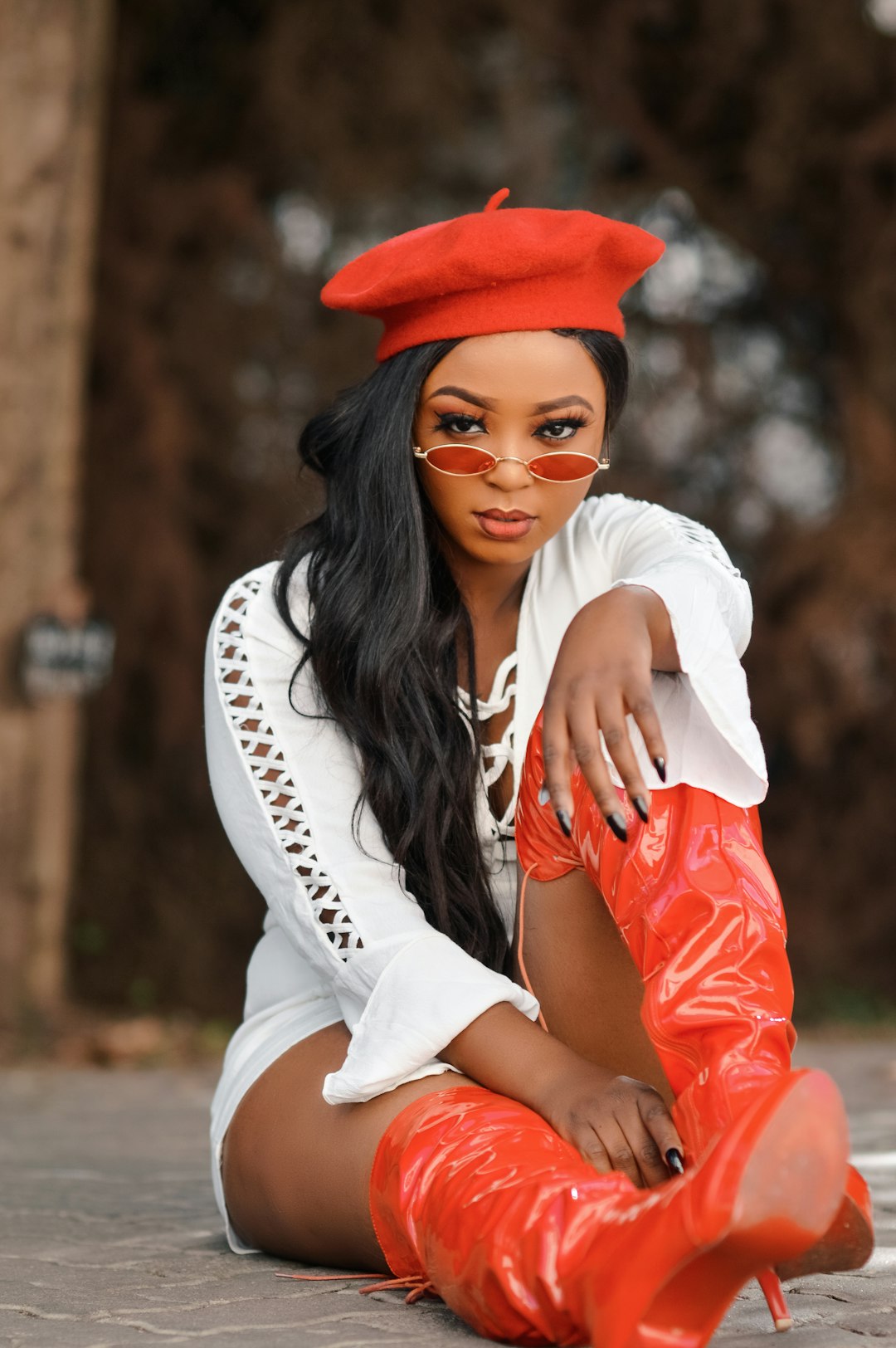 woman in white shirt and red hat