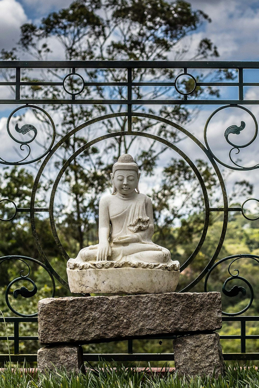 white concrete statue of a man