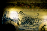An old mural depicting warriors clashing in Gaza's ancient alleys.