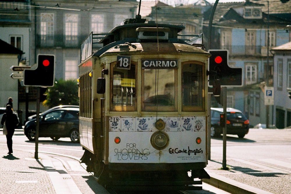 white and yellow tram on road during daytime