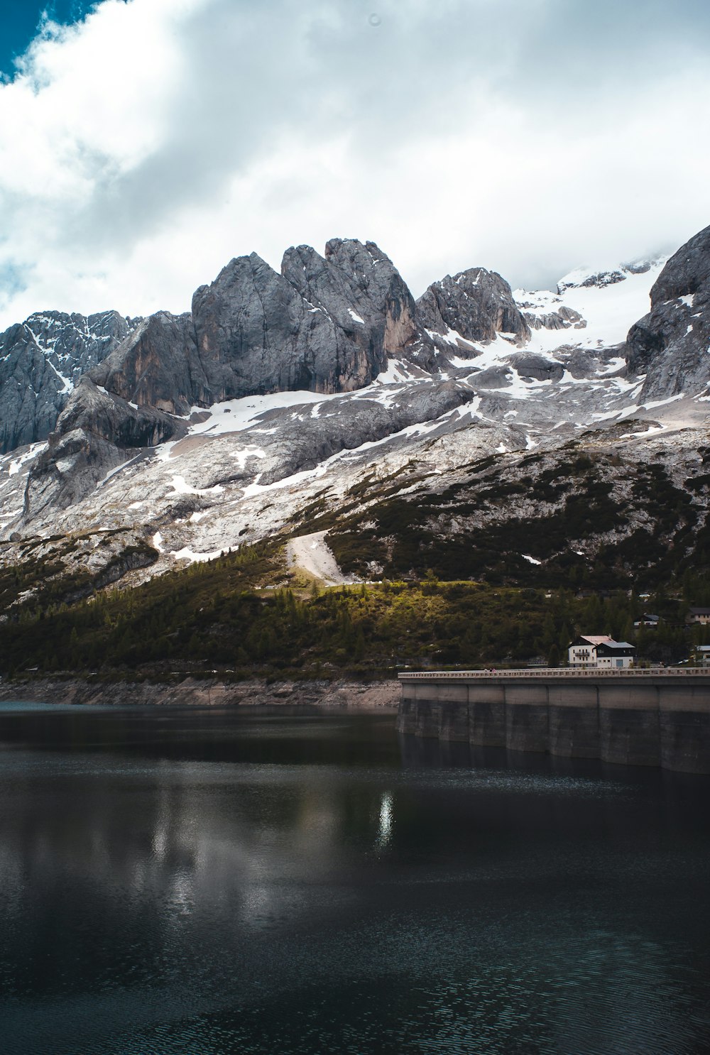 white and brown mountains near body of water during daytime