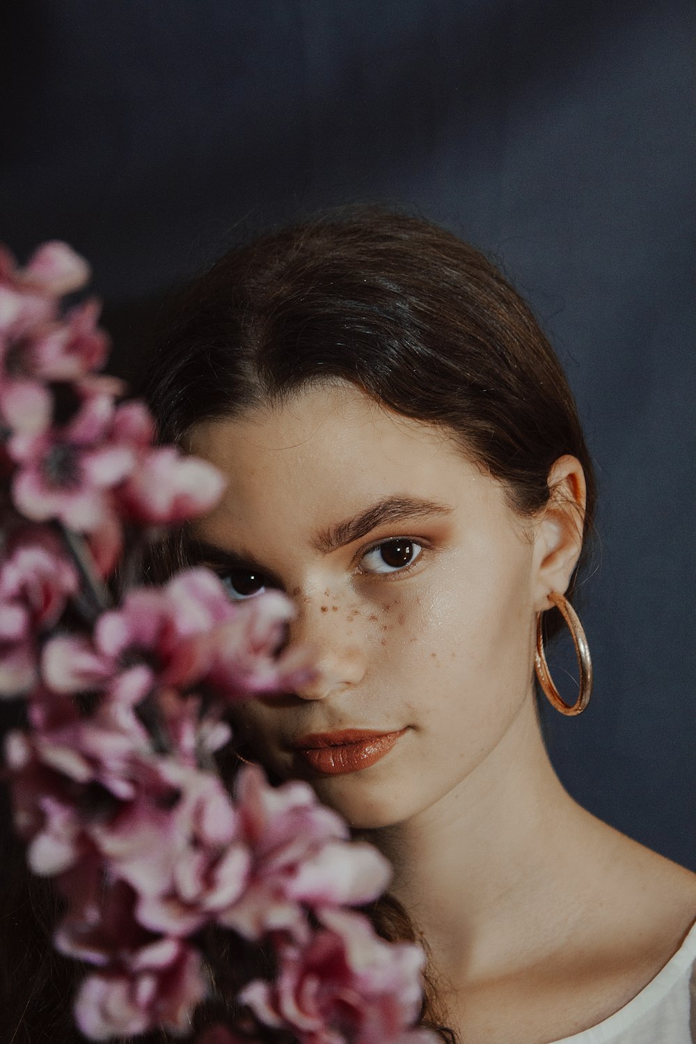 woman with gold hoop earrings