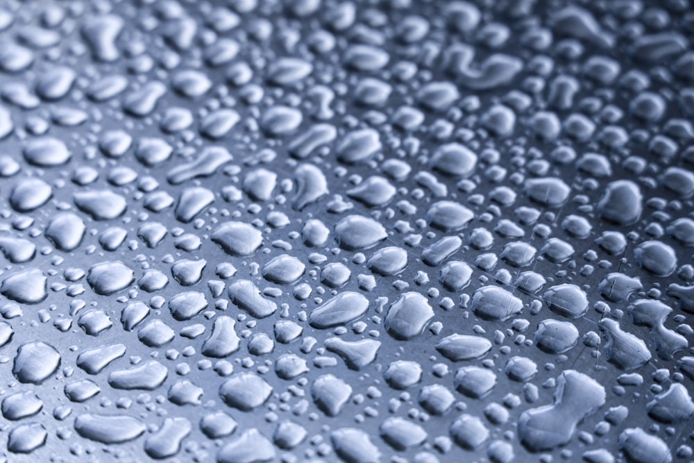 water droplets on blue surface