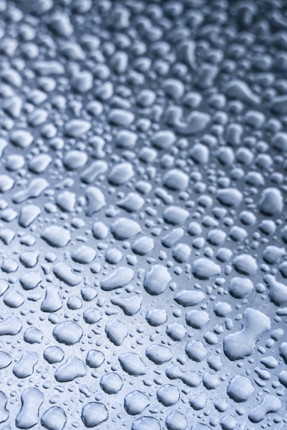 water droplets on gray surface