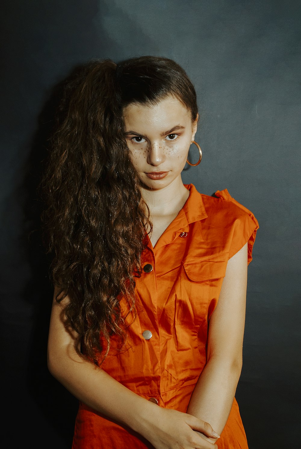 woman in orange button up shirt