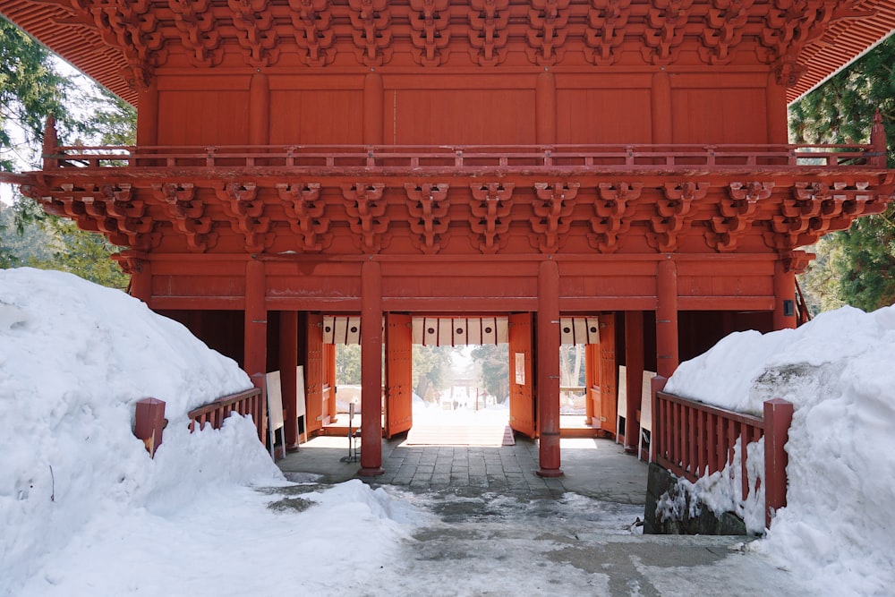 brown wooden building covered with snow