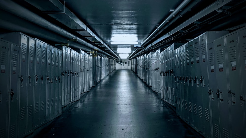 grayscale photo of hallway with lights