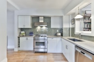 white wooden kitchen cabinet with gray kitchen cabinet