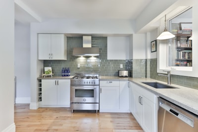 white wooden kitchen cabinet with gray kitchen cabinet