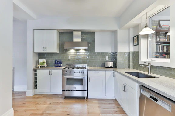 white wooden kitchen cabinet with gray kitchen cabinet