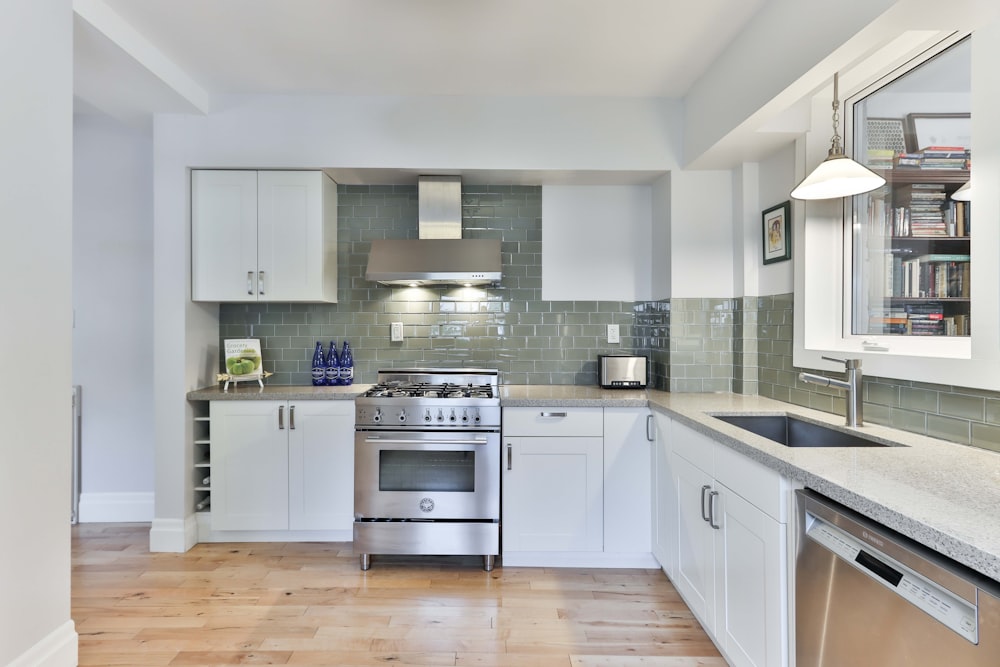 white wooden kitchen cabinet with gray kitchen cabinet