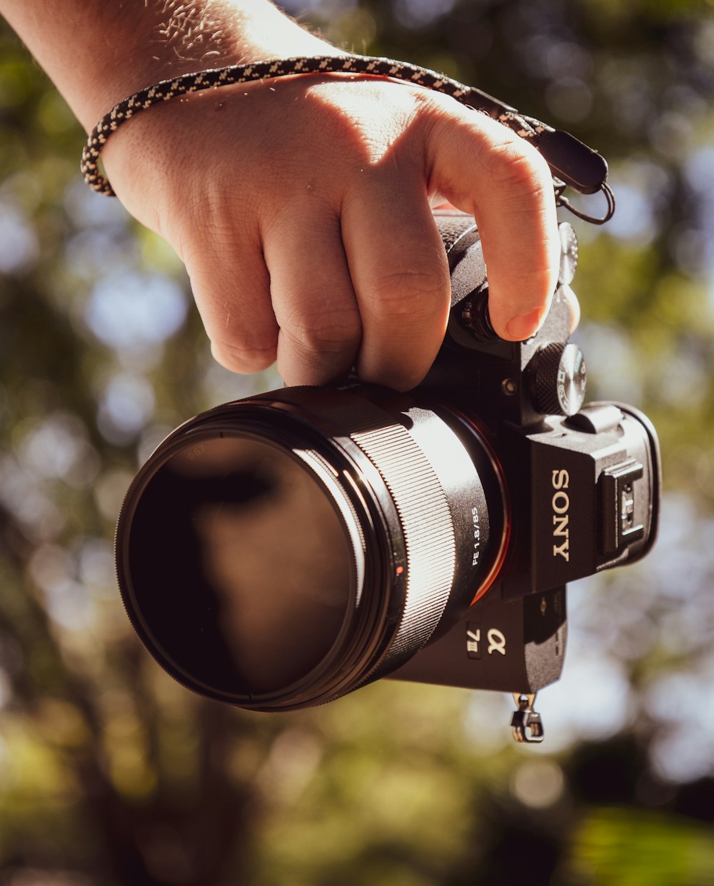 person holding black nikon dslr camera