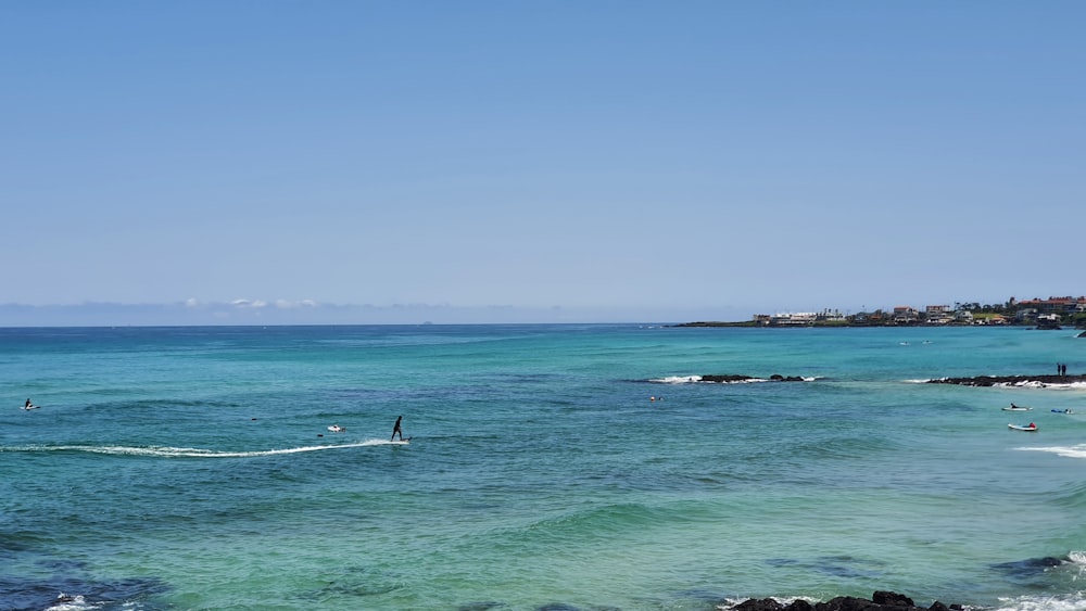 person surfing on sea during daytime