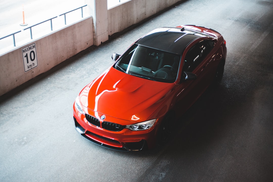 red ferrari car on road during daytime