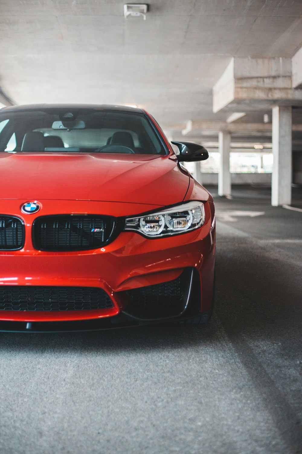 red bmw m 3 on road during daytime