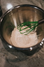 brown powder in stainless steel bowl