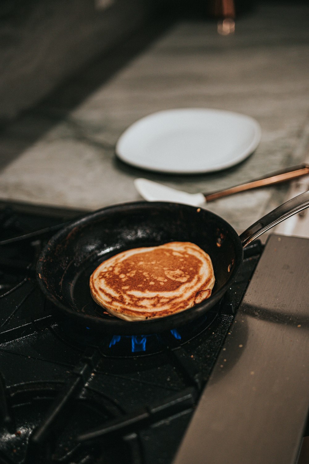 black frying pan with brown liquid