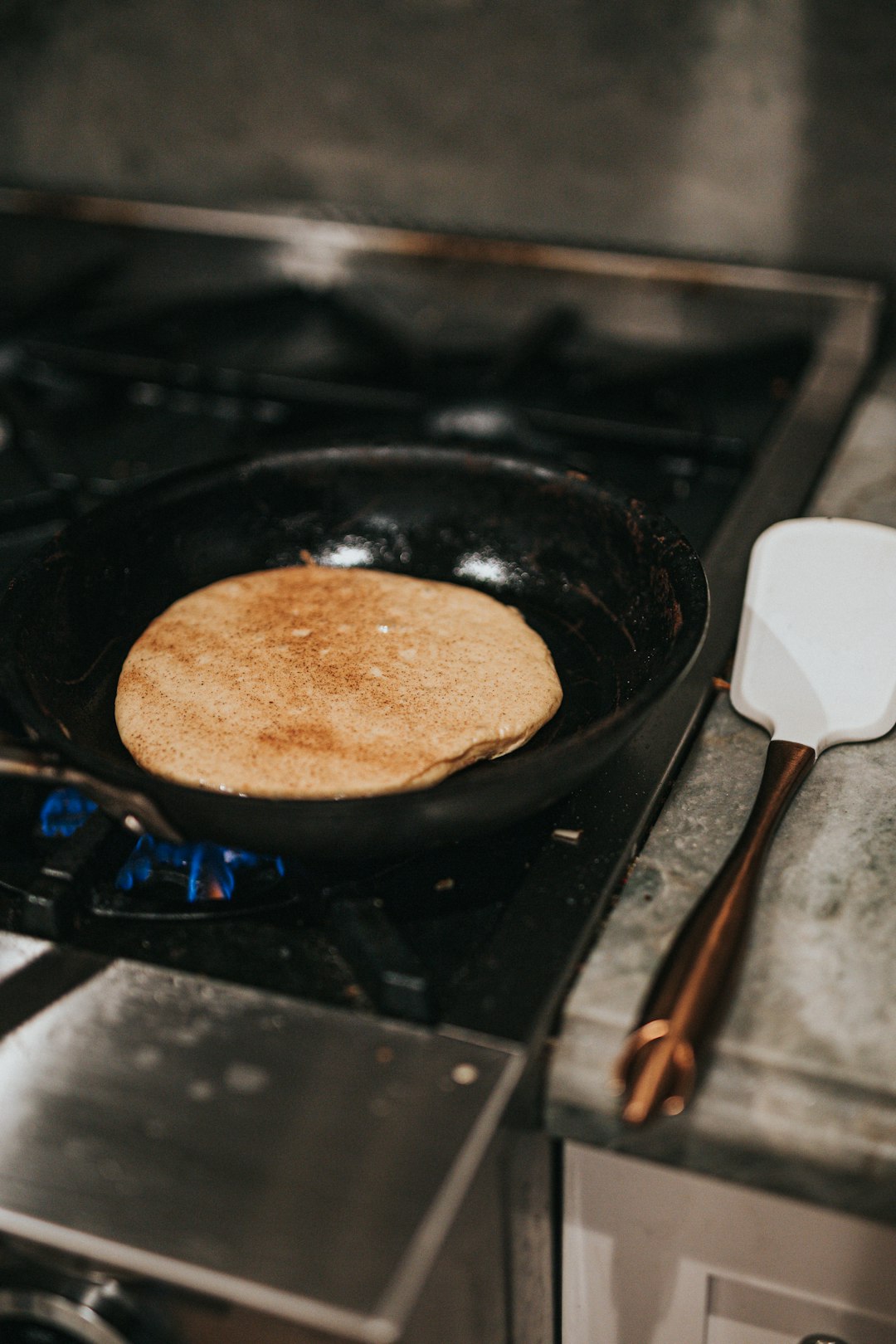 brown round food on black pan