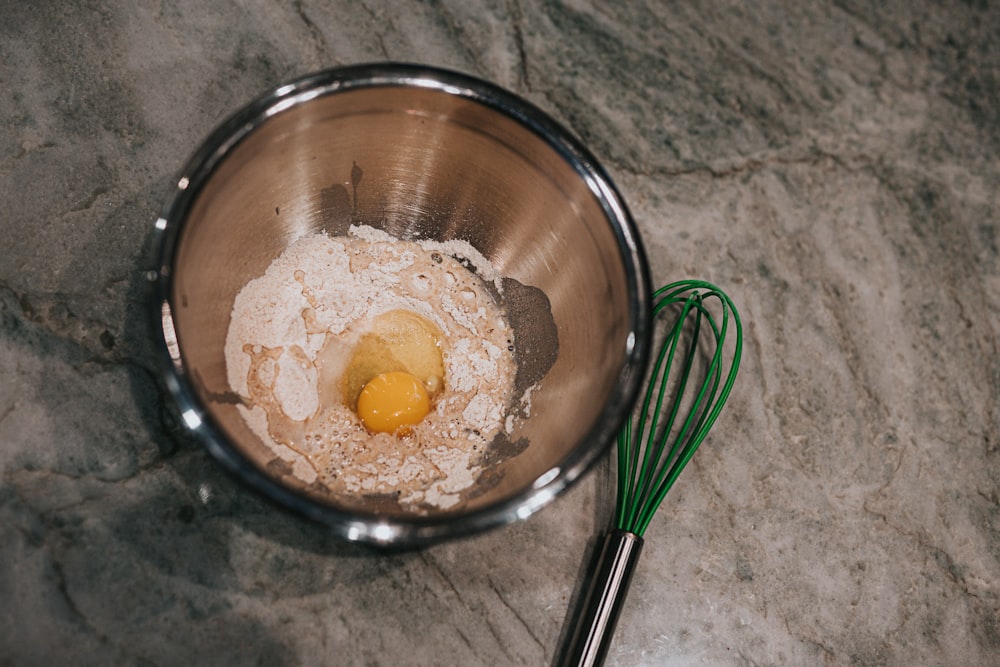 yellow food in stainless steel bowl