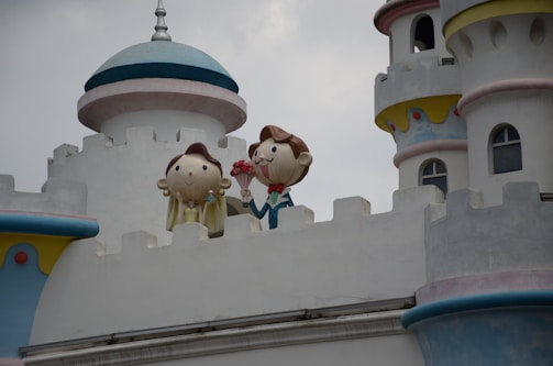 Playful illustration of a child exploring a castle with friendly dragons