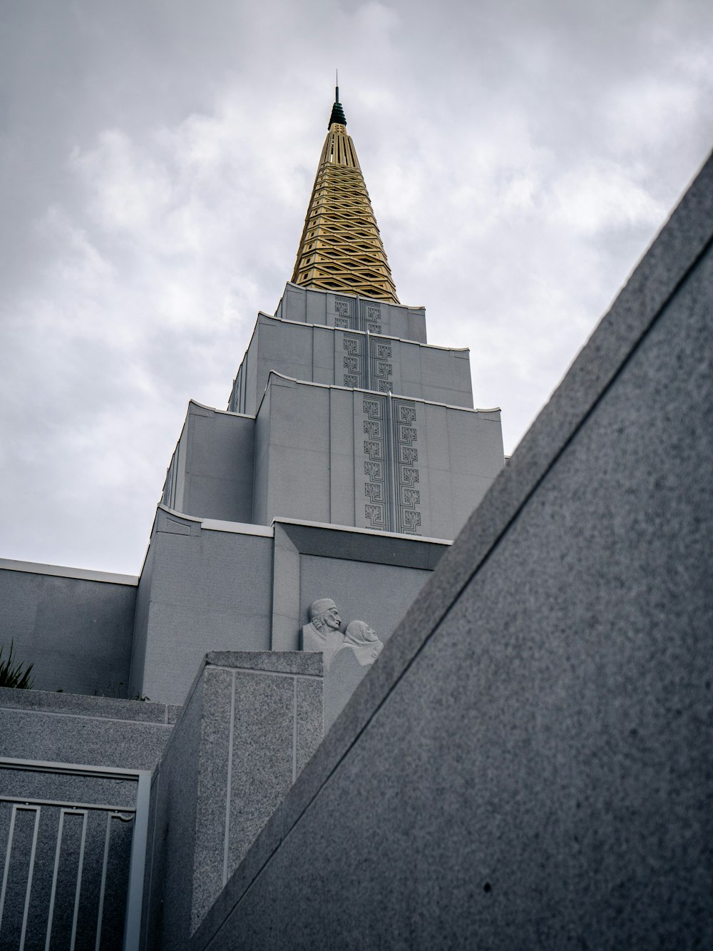 gray concrete building under white clouds during daytime