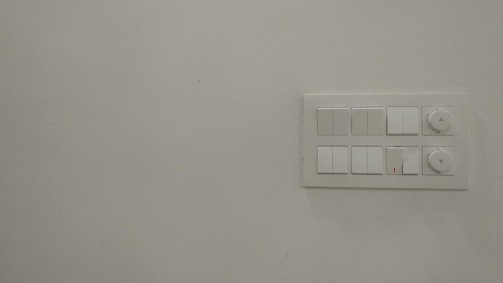 AMF panel mounted on a wall, showing the user interface and switches.