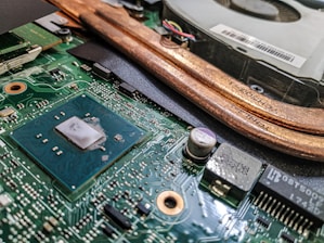 Close-up of a sleek CPU resting on a motherboard with glowing electric blue accents.