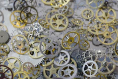 Array of finished metal gears neatly arranged on a factory table.