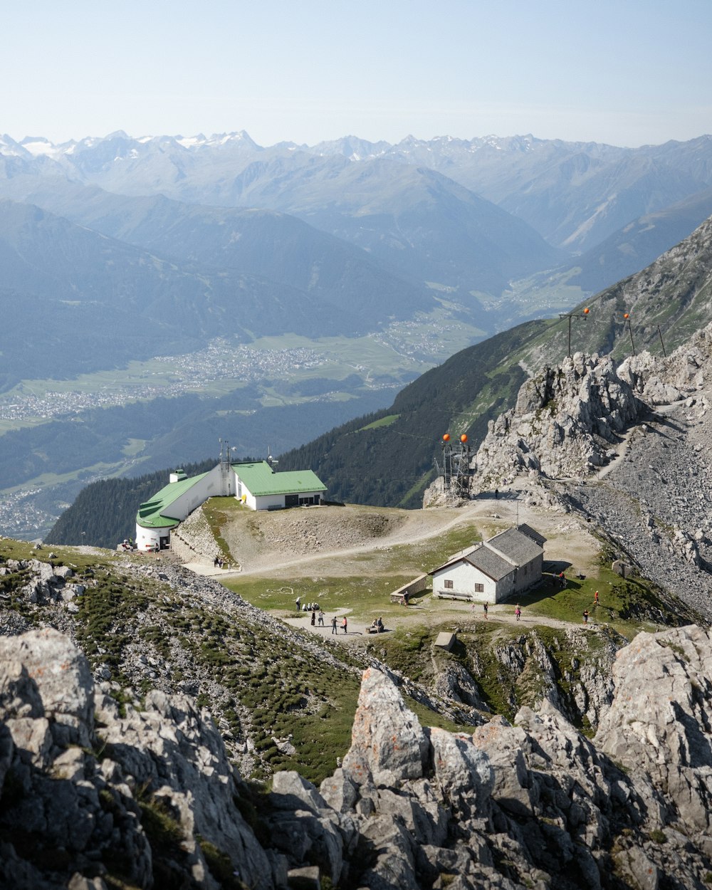 green and white house on top of the mountain