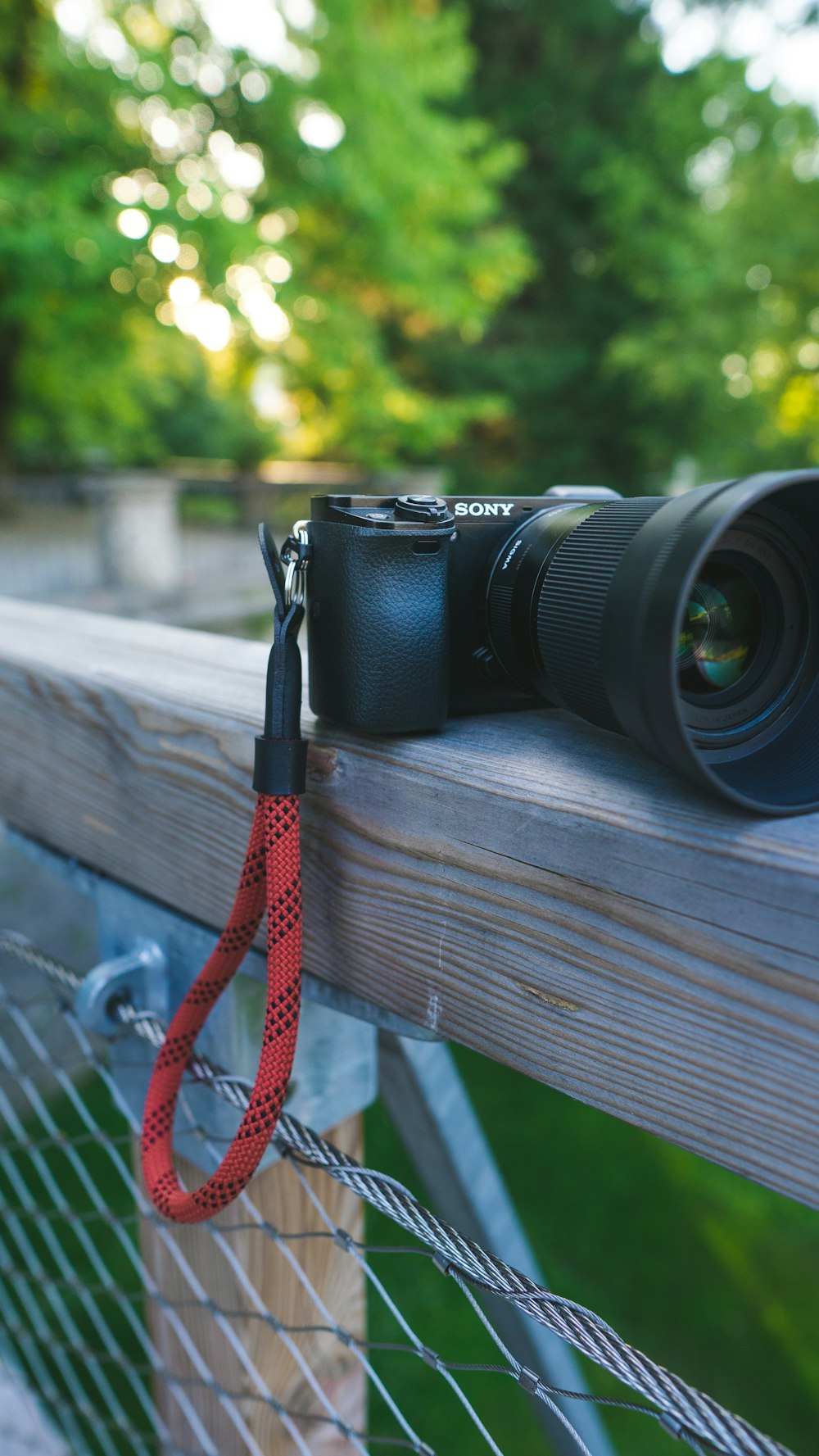 black nikon dslr camera on brown wooden table