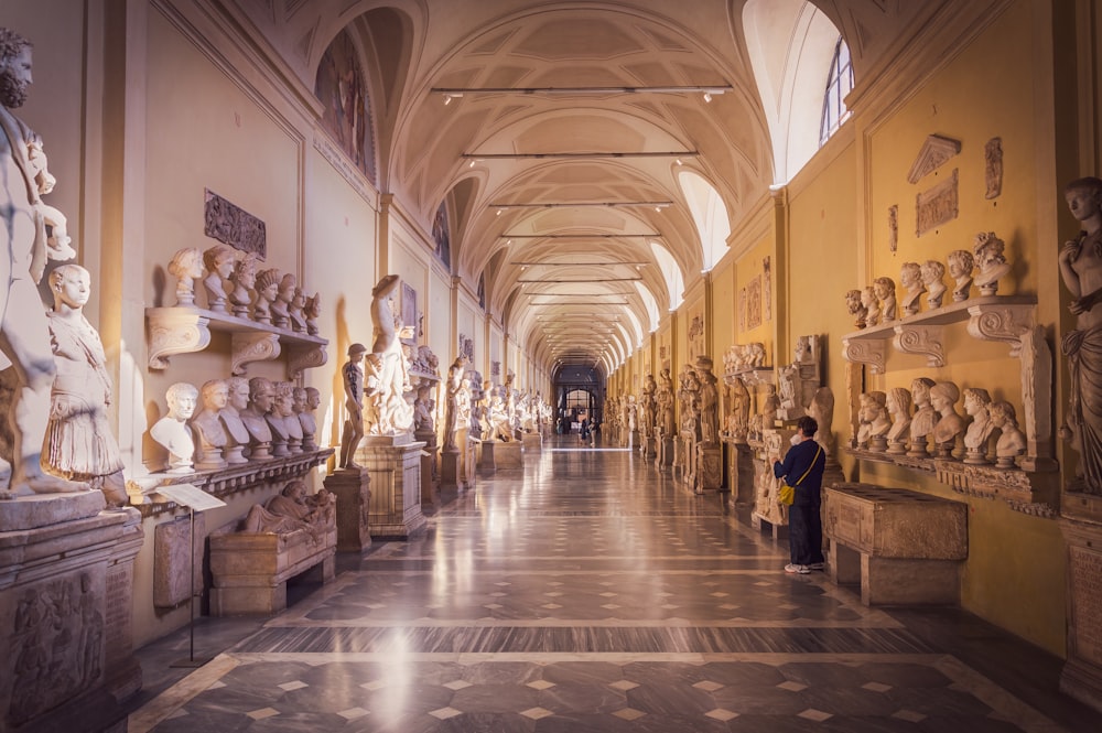 people walking on hallway inside building