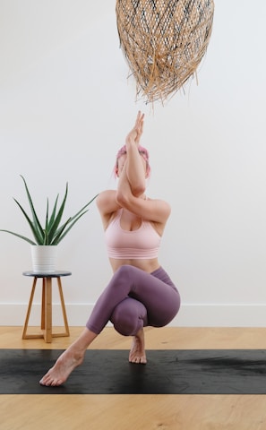 woman practicing yoga, mindfullness, and peace