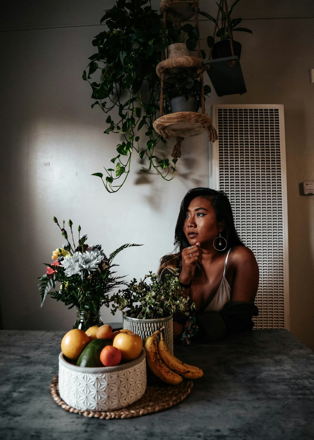 woman in black tank top sitting on chair