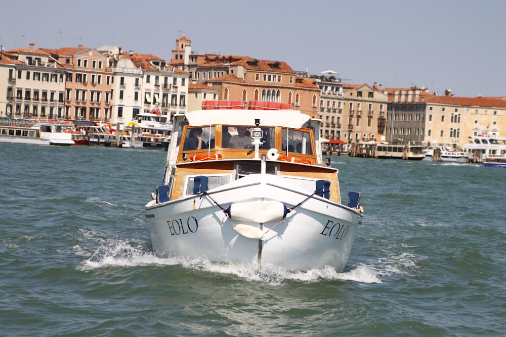 white and blue boat on sea during daytime