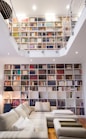 white wooden book shelves with books